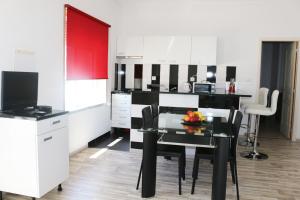 A cozinha ou kitchenette de Alojamento Local S. Bartolomeu