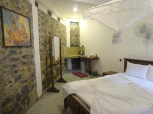 Postel nebo postele na pokoji v ubytování The ED Corner - Hiriketiya