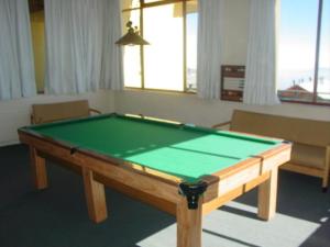 a pool table in a living room with afits at Apartamento El Colorado in El Colorado