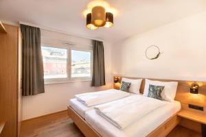 Posteľ alebo postele v izbe v ubytovaní LISAL Appartements