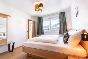Posteľ alebo postele v izbe v ubytovaní LISAL Appartements
