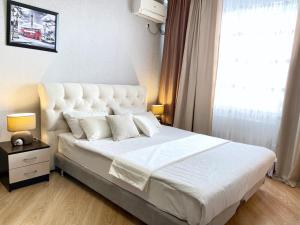En eller flere senge i et værelse på Вид на стадион Краснодар