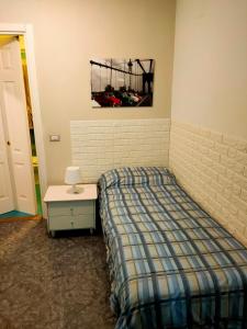Postel nebo postele na pokoji v ubytování L'Attico