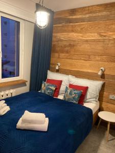 Posteľ alebo postele v izbe v ubytovaní Apartament Komorowskiego