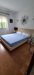 a bedroom with a large bed in a room at maison nathalia in Jávea