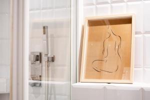 a drawing of a woman in a bathroom window at Casa Cosi - Casanova 2 in Barcelona