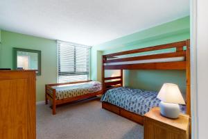 a bedroom with two bunk beds and a mirror at Sea Colony -- 112 Georgetowne in Bethany Beach +42 photos