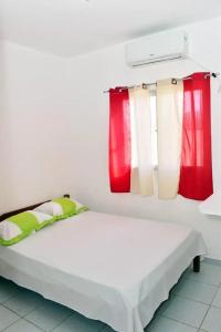 Postel nebo postele na pokoji v ubytování Condominio Oliveira