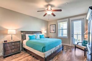 a bedroom with a bed and a ceiling fan at Driftwood Galveston Resort Escape with Deck and View in Galveston +50 photos