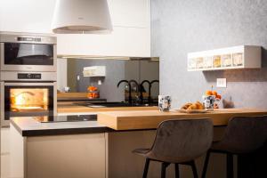 Kuchyň nebo kuchyňský kout v ubytování Style Apartment