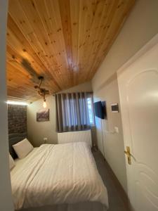 Un pat sau paturi într-o cameră la Villa Elear