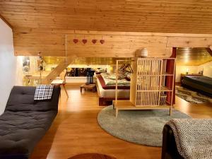 a living room with a couch and a bed at Highest terrace Verbier center. Top comfort & view in Verbier