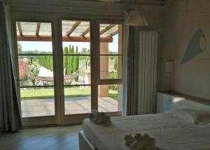A bed or beds in a room at Fattoria Palazzeta - Pet & Family Friendly