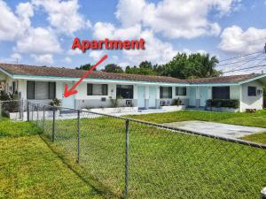 a house with a sign that says apartment at Very Glam Apartment 5 Miles From Hard Rock in Hollywood