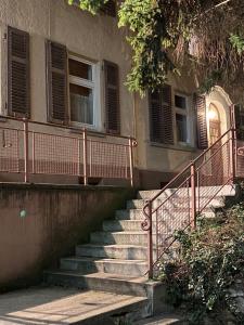a set of stairs in front of a building at Altbauwohnung Stuttgart Ost in Stuttgart