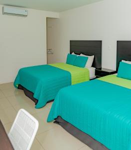 Postel nebo postele na pokoji v ubytování Hotel Los Rios