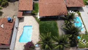 an overhead view of a backyard with two swimming pools at Casa na Ilha da Crôa in Barra de Santo Antônio