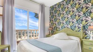 Postel nebo postele na pokoji v ubytování Villa Crisa - Lloret de Mar + 20 fotografií