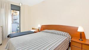 Postel nebo postele na pokoji v ubytování Apartment StaCris2 - Lloret de Mar + 10 fotografií