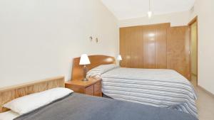 Postel nebo postele na pokoji v ubytování Apartment StaCris2 - Lloret de Mar