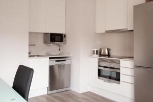 Kuchyňa alebo kuchynka v ubytovaní APBCN Eixample Center