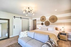 a bedroom with a bed and a couch at Bright Tybee Island Townhome - Walk to the Beach! in Tybee Island