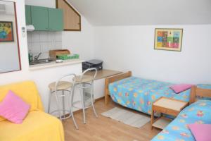 Kuchyň nebo kuchyňský kout v ubytování Apartment and Room Silvana