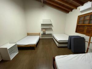 מיטה או מיטות בחדר ב-Chácara Klein