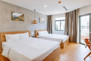 Postel nebo postele na pokoji v ubytování Maya Hotel 3