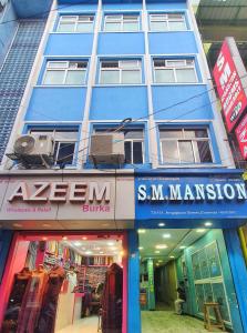 a blue building with a store in front of it at SM MANSION near Harbour & High court in Chennai