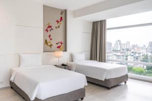 曼谷茉莉花 59 號飯店 (Jasmine 59 Hotel Bangkok)房間的床