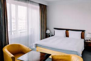 Cama o camas de una habitación en Rahat Palace Hotel