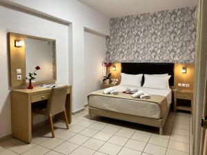 Letto o letti in una camera di Caravel Hotel Apartments