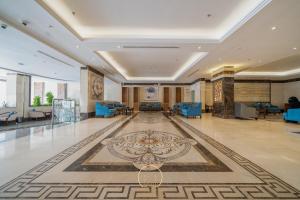 a large lobby with a large rug on the floor at Moon View Hotel in Jeddah