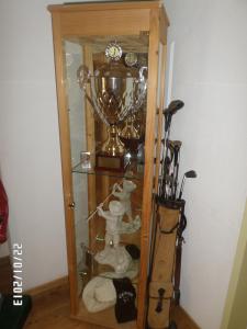a trophy and trophies in a glass case at Hotel Mira in Sedrun