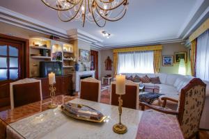 a living room with a table and a couch at Casa Rural Finca Real De Niebla in Niebla