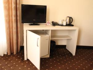 a white desk with a television on top of it at Jermuk Verona Resort in Jermuk