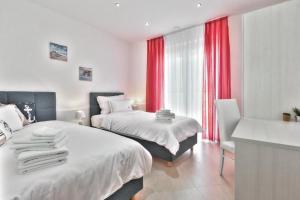 Ένα ή περισσότερα κρεβάτια σε δωμάτιο στο Casa Siesta +39 φωτογραφίες