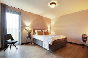 Un pat sau paturi într-o cameră la Op dn Kreijtenberg