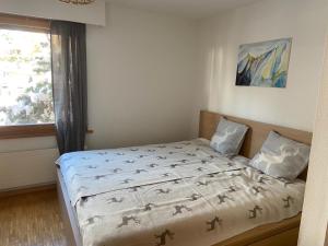 Postel nebo postele na pokoji v ubytování Rose des Alpes