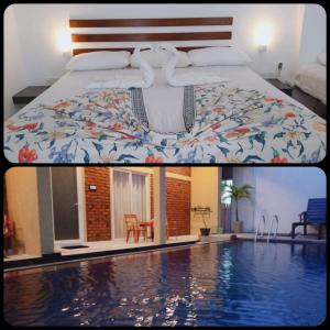 a hotel room with a bed and a swimming pool at Petit Guest House in Negombo