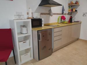 Kuchyňa alebo kuchynka v ubytovaní Apartamentos Naranja y Limòn