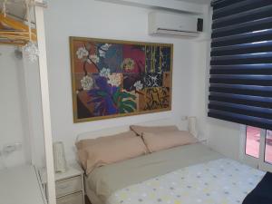 Posteľ alebo postele v izbe v ubytovaní Apartamentos Naranja y Limòn