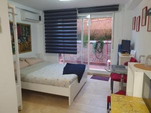 Posteľ alebo postele v izbe v ubytovaní Apartamentos Naranja y Limòn