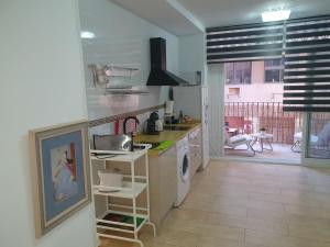 Кухня или кухненски бокс в Apartamentos Naranja y Limòn