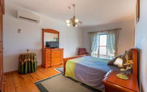 Postel nebo postele na pokoji v ubytování Quinta Do Ribeirinho + 46 fotografií