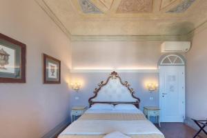 Postel nebo postele na pokoji v ubytování B&B I Quattro Poeti