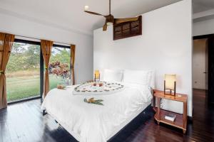 a bedroom with a bed with a cake on it at Legion at Morningstar Breeze Gold Standard Certified in Hopkins +33 photos