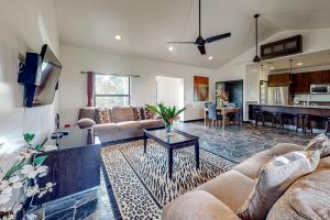 a living room with two couches and a table at Waimea at Morningstar Breeze Gold Standard Certified in Hopkins