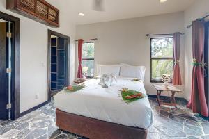 a bedroom with a large bed with flowers on it at Waimea at Morningstar Breeze Gold Standard Certified in Hopkins